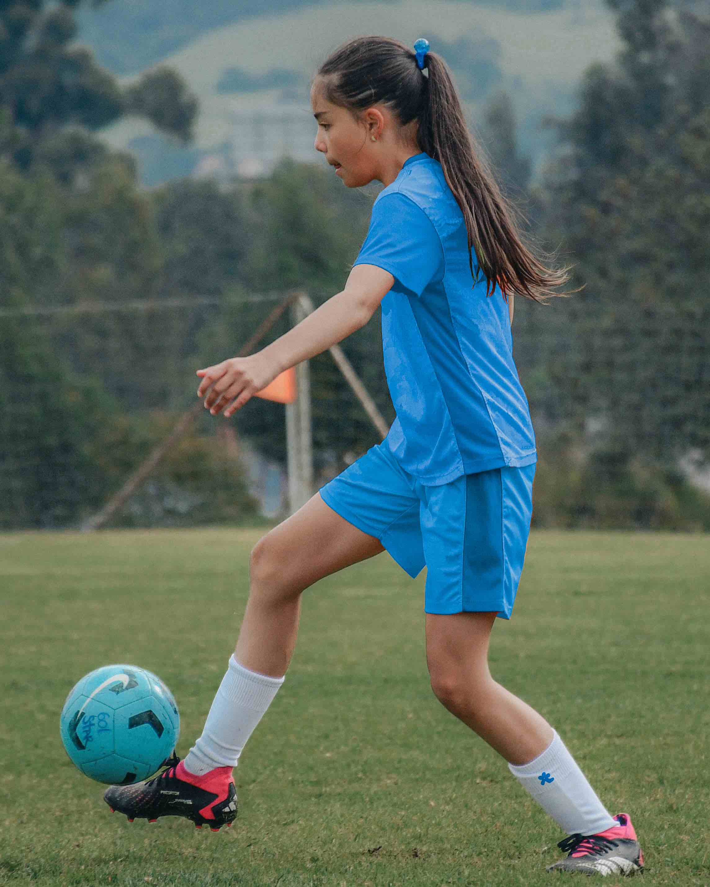 hana community member girls in blue girls football kit and girls football socks